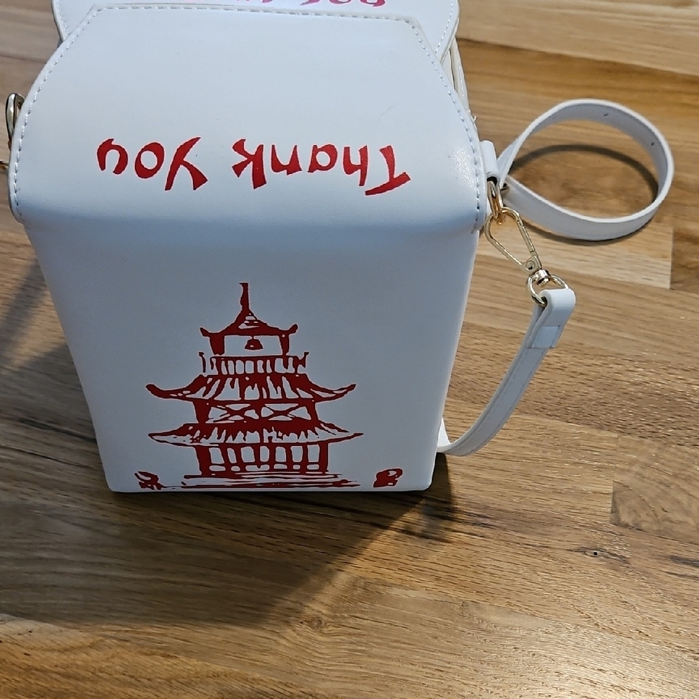 White and Red Crossbody Bag with Cultural Charm